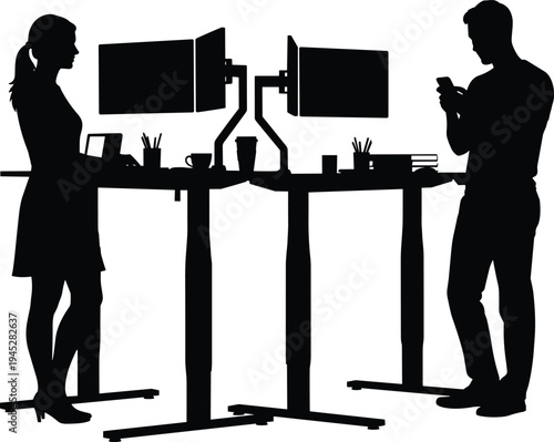 Black silhouettes of a man and woman working at standing desks with dual monitors in a modern office isolated on white,