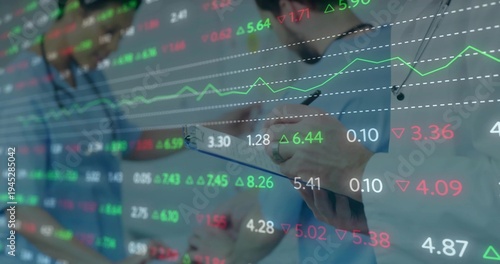 Holding clipboard and pen, three docs writing in clinic, in scrubs and steths, with stock tickers