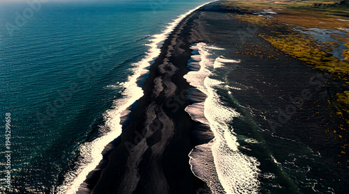 Dramatic Aerial View of Volcanic Black Sand Coastline Meeting Deep Blue Ocean Waves with Geometric Surf Patterns Overhead Perspective