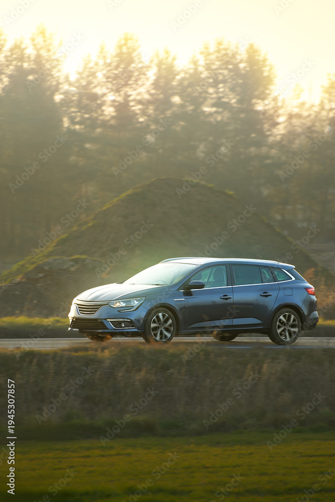 Fototapeta premium Modern sports wagon in natural landscape