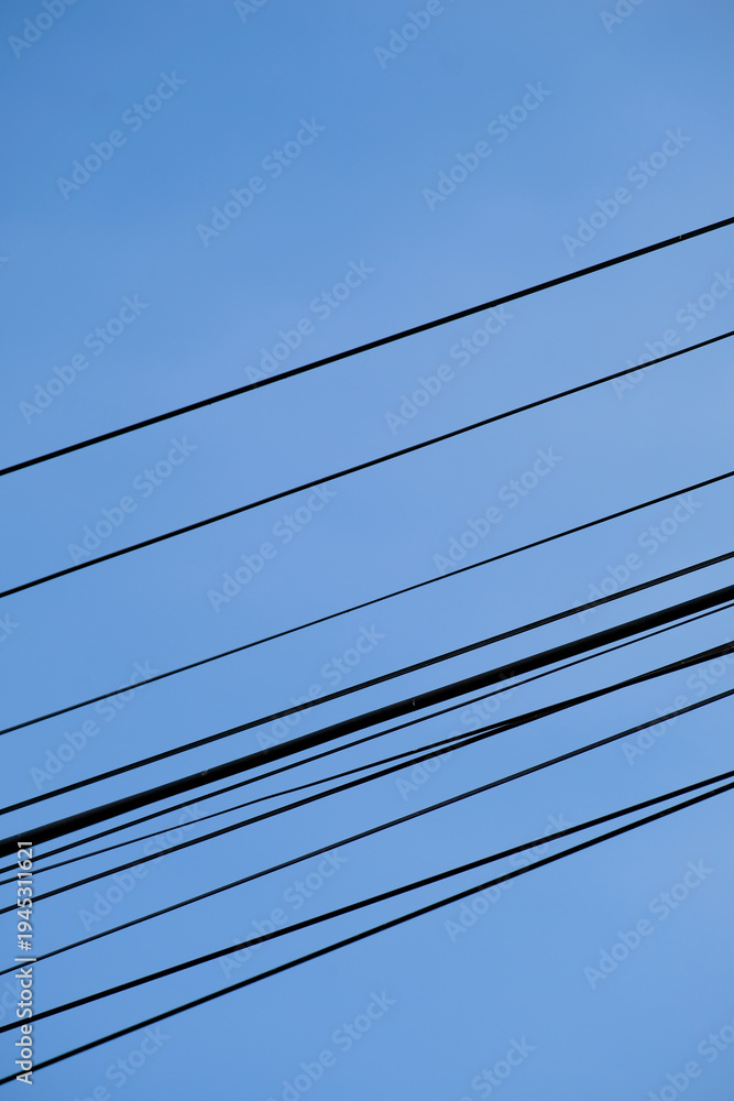 custom made wallpaper toronto digitalLines in the sky. A minimalist shot of power cables crossing a clear sky, vibrant blue background