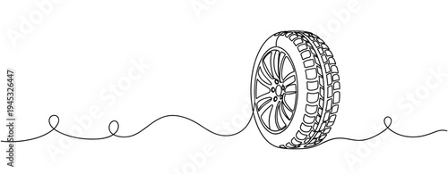 Automobile wheel standing upright on plain white background