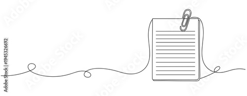 Notepad clipped with paperclip on lined sheet over white background