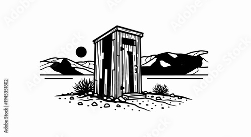 Rustic wooden outhouse stands against a backdrop of stark mountains and a setting sun