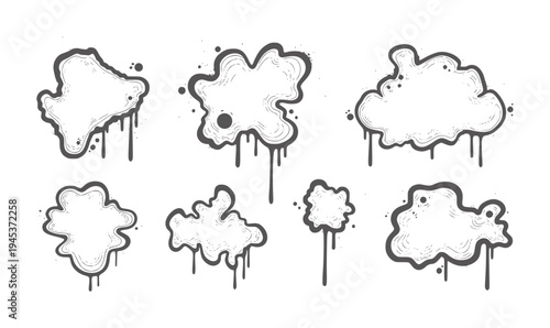 Collection of seven irregular black and white ink splatters with dripping effect