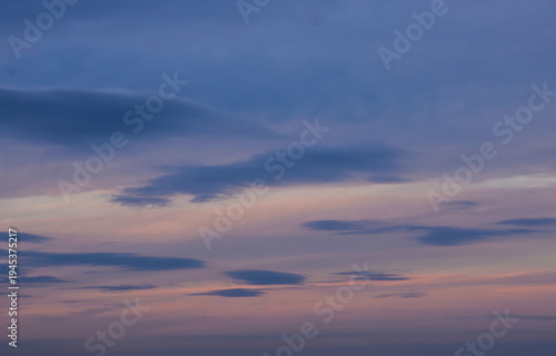 Deep violet twilight sky with textured dark purple cloud layers