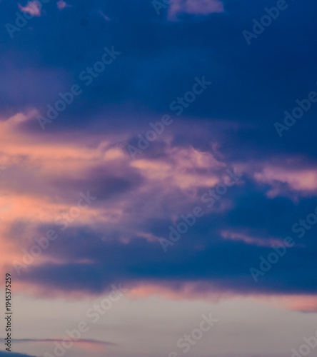 Dramatic blue hour sky with vibrant fiery orange cloud highlights