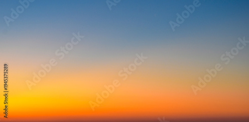 Dramatic blue and magenta sunset sky with soft wispy clouds