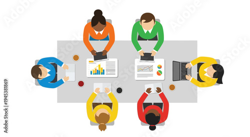 a group of people sitting around a table with laptops and papers on it.