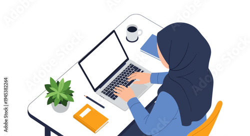 woman wearing hijab working on laptop.