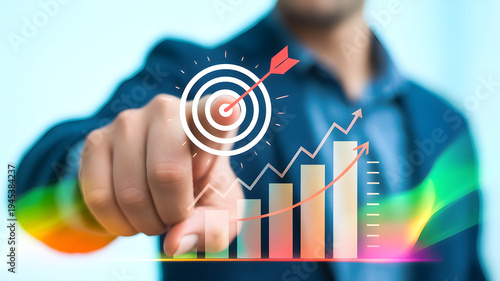Male hand touching virtual target bullseye with rising bar graph and upward line chart illustrating business development and corporate success metrics