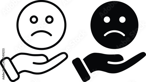 A black and white illustration of two sad faces being supported by hands.