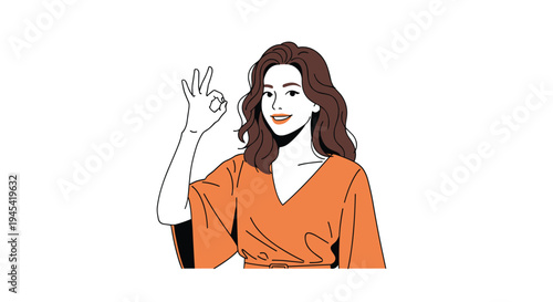 Pretty young woman with long wavy brown hair wearing an orange dress and showing an okay hand sign with a bright smile.