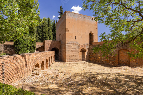 Alhambra complex tower and brick wall in Granada, Spain