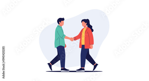 Professional man and woman are shaking hands to seal a business deal or greet each other in a friendly manner.