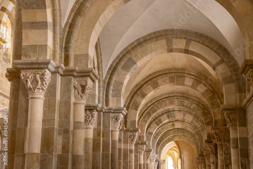 Vezelay Basilica aisle showing Romanesque architecture and carved capitals