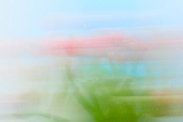 Abstract Motion Blur of Pink Flowers and Green Foliage Background