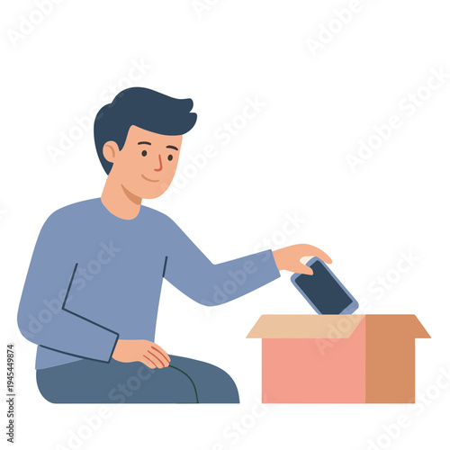 Man sitting and pulling a phone out of a cardboard box indoors