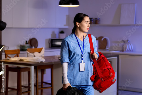 Female doctor with bag suff...