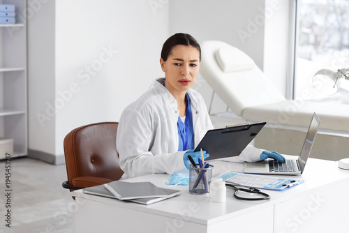 Female doctor with clipboar...