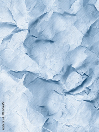 Crumpled blue paper texture closeup.