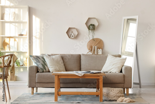 Beige comfortable sofa, tab...