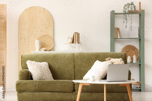 Green sofa and table with m...