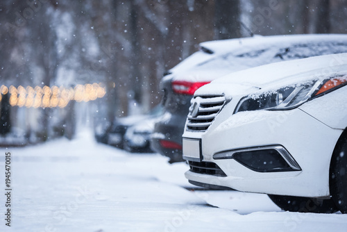White car covered with snow...
