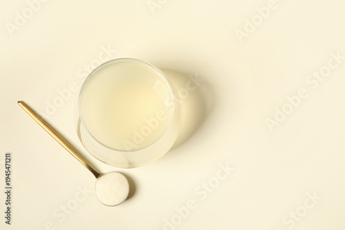 Glass of water and spoon wi...