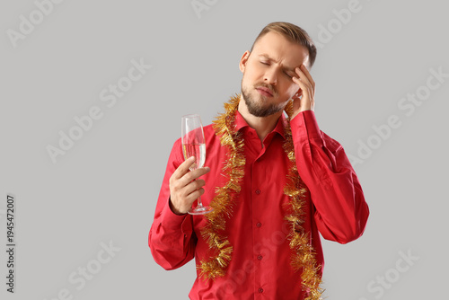 Young man with hangover and...