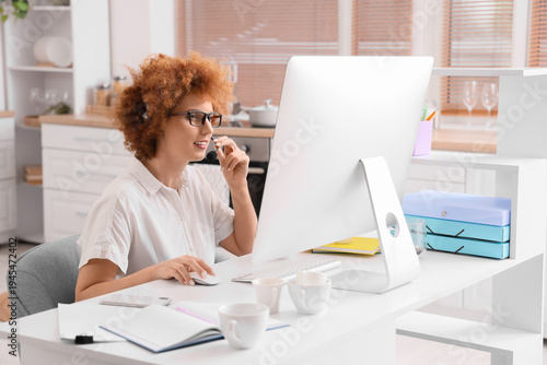 Redhead female freelancer w...