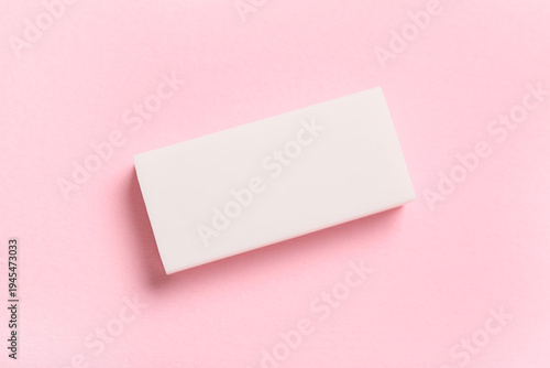 White rubber eraser on pink...