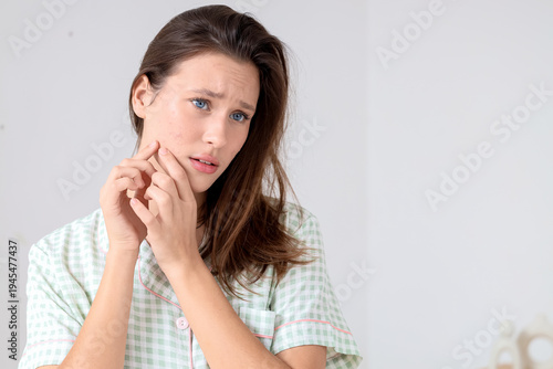 Young woman with acne probl...