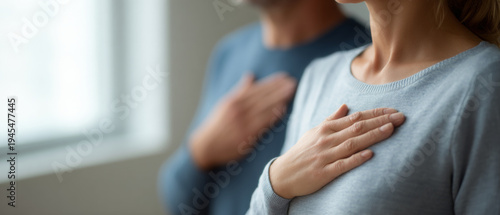 People pledging allegiance with hands on chest