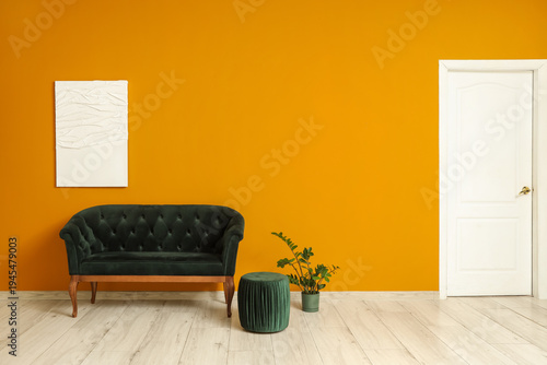 Comfortable sofa, pouf and ...