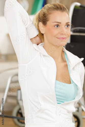 a young disabled woman during arms stretching Free Download a young disabled woman during arms stretching - GFXLoad