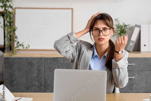 Shocked young businesswoman...