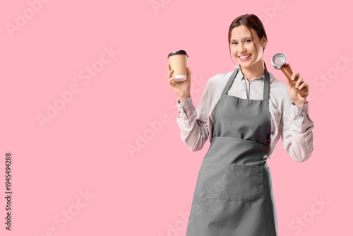 Happy young female barista ...