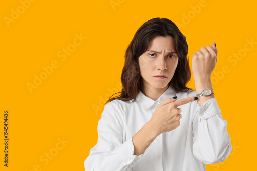 Tired young woman pointing ...