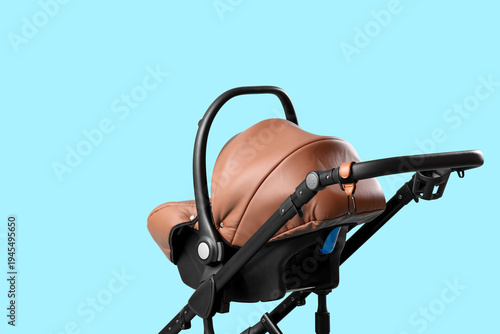 Modern baby stroller on blu...
