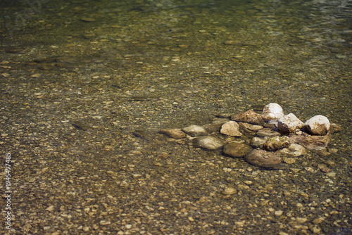 Slika na platnu Close up video of crystal clear turquoise water on the shallows of Lake Bohinj