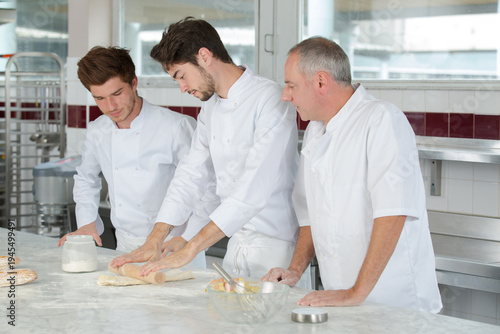 students girls in pastry holding cakes