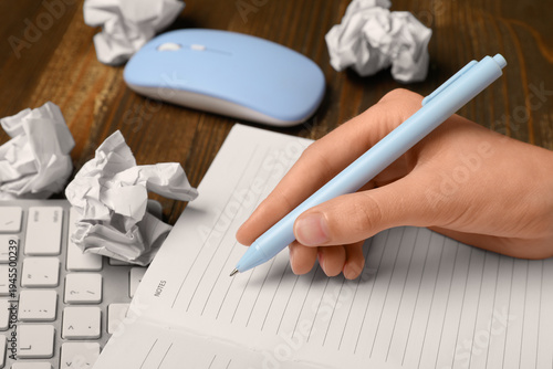 Female hands with notebook ...