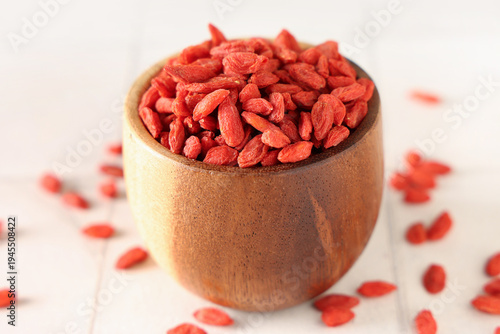 Wooden bowl with dried goji...