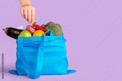 Female hand with vegetables...