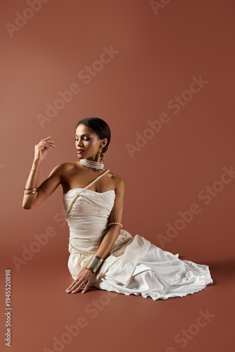 Bild auf Leinwand Young bride radiates elegance in a stunning white dress at a studio setting
