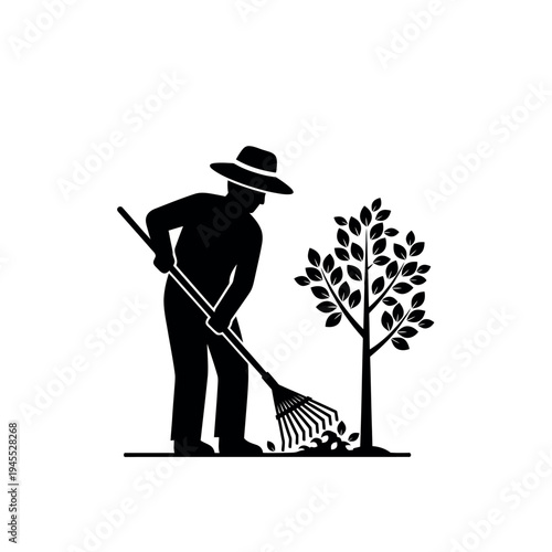 Gardener raking leaves under a tree silhouette.