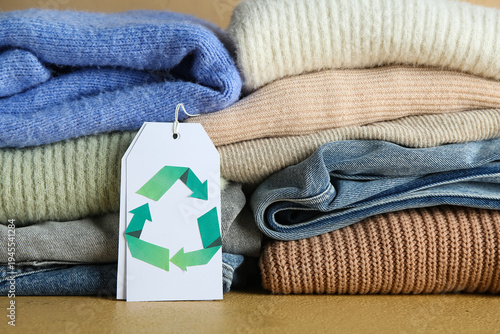 Stacks of clothes and tag w...