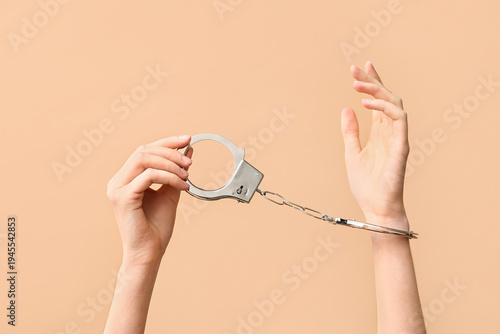Female hands with handcuffs...