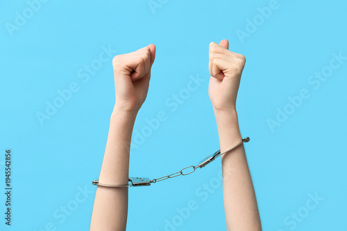 Female hands in handcuffs o...